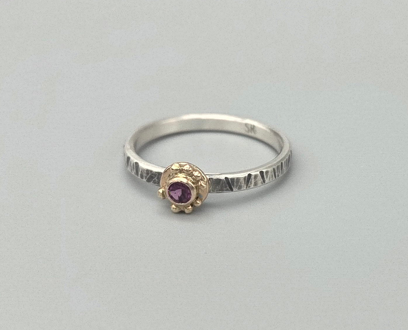 Rhodolite Garnet with Gold bezel setting textured silver band